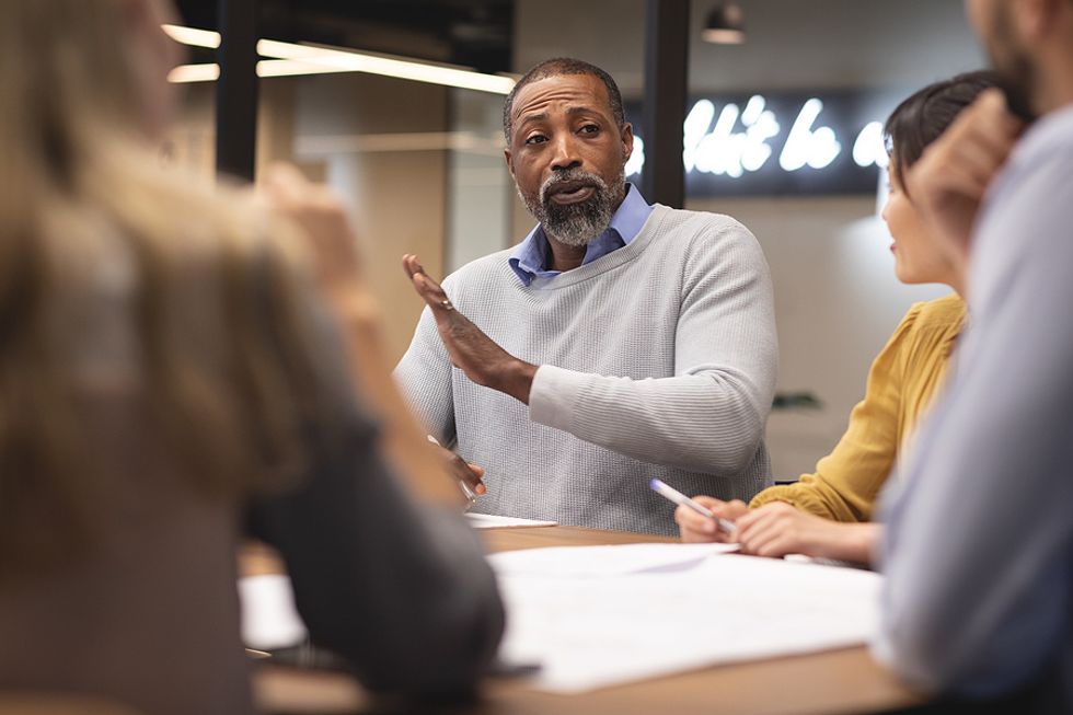 Executive speaks to his employees during a crisis
