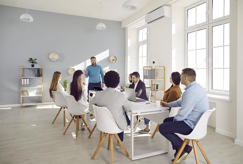 Executive talks to his team during a work meeting