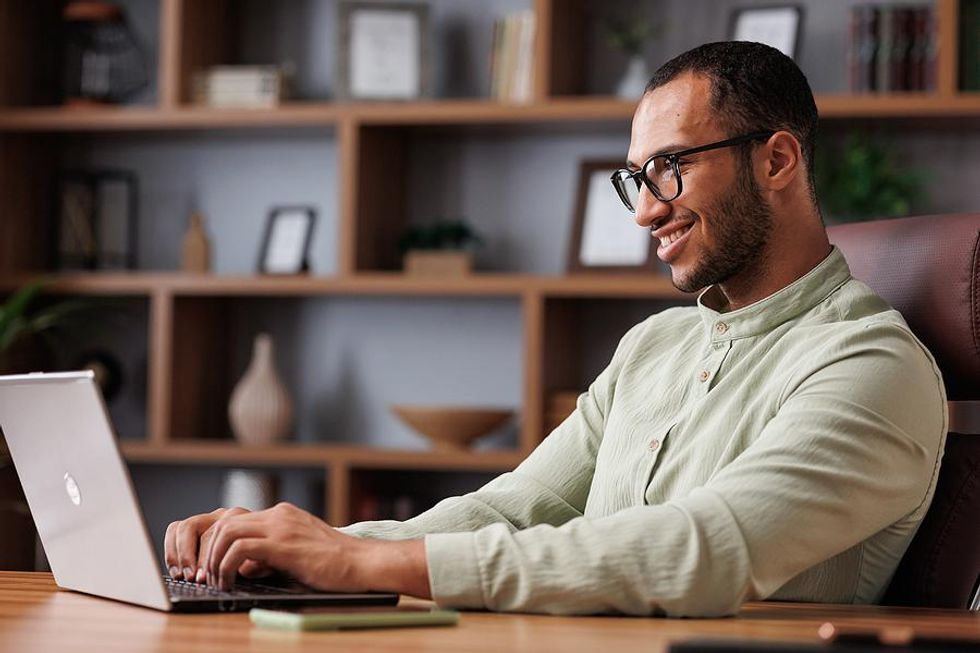 Executive uses a new technology on his laptop