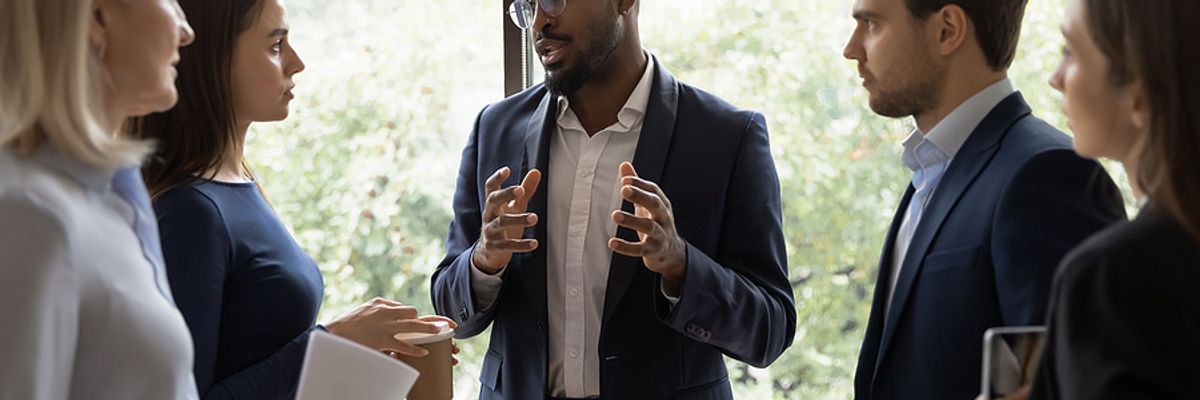 Executive uses his leadership skills during a team meeting