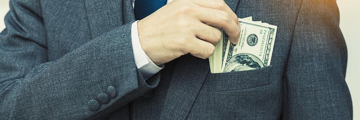 Executive with money in his pocket