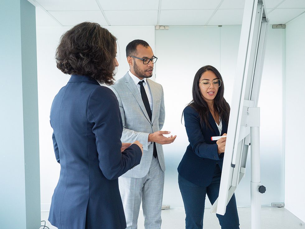 Executives discuss challenges during a meeting