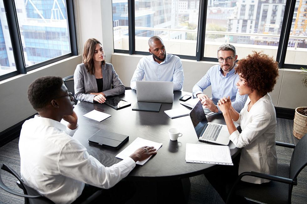 Executives discuss failure during a meeting