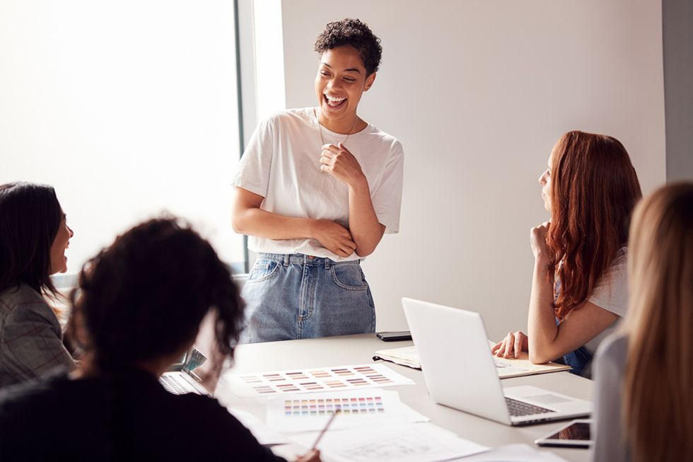 Female boss using her soft skills to effectively lead an office meeting