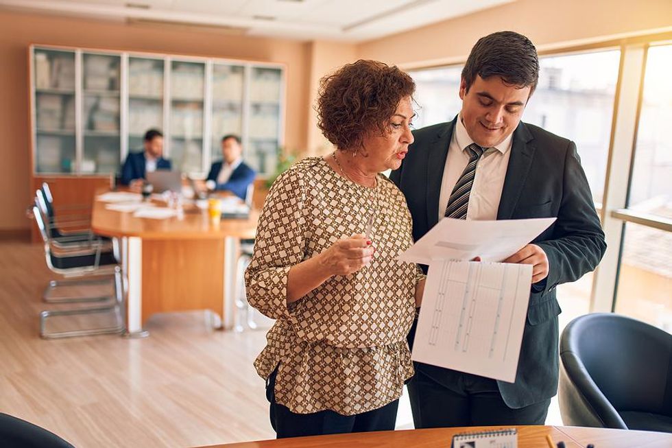 Female executive goes over her plan for 2021 with a colleague