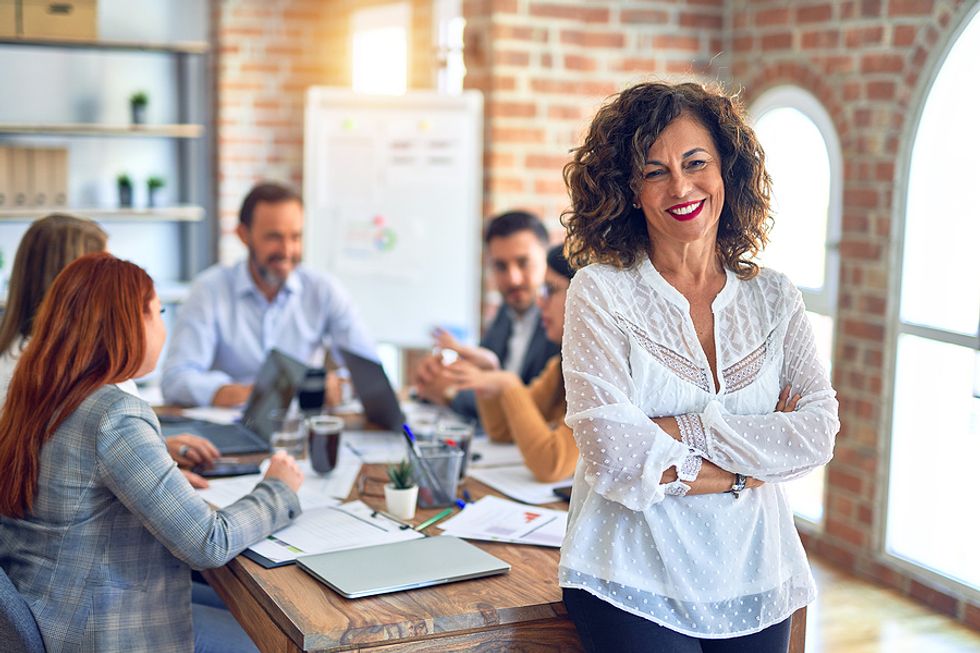 Female executive leads a meeting and manages her business relationships