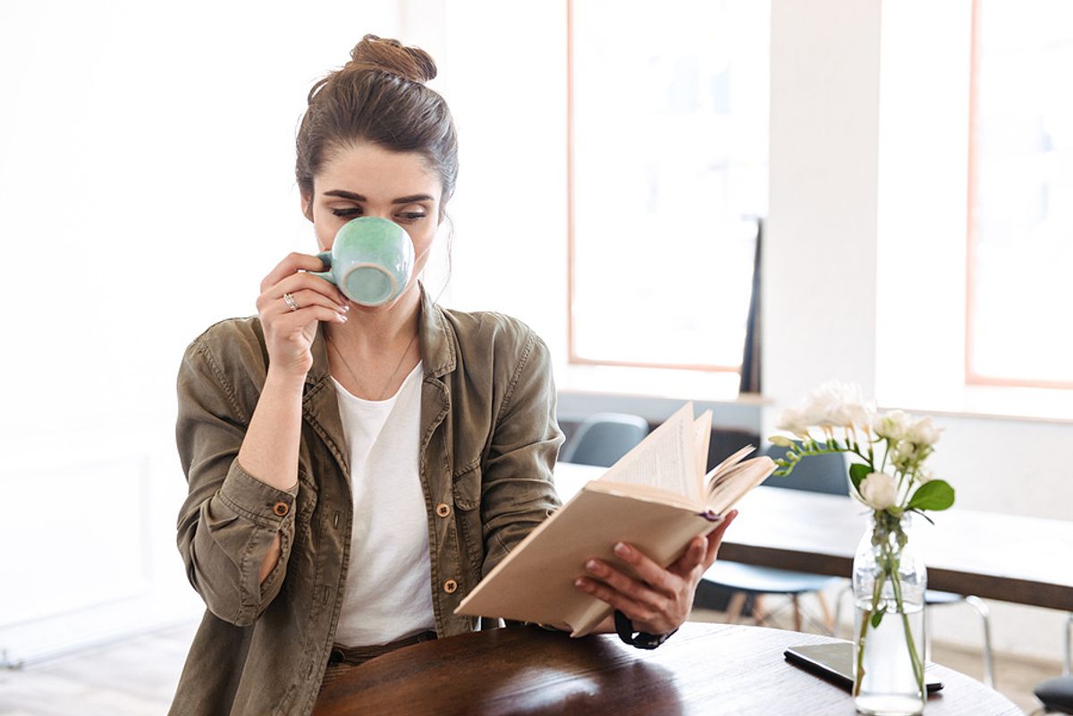 Female executive reads a book