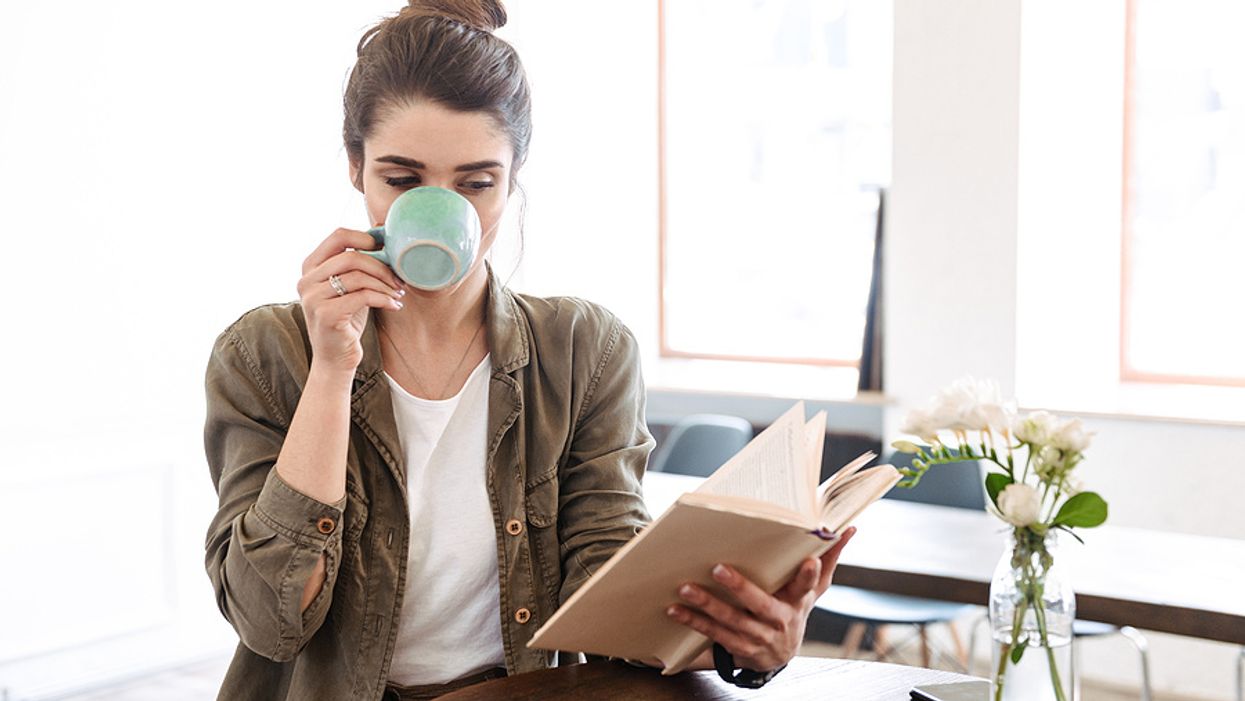 Female executive reads a book
