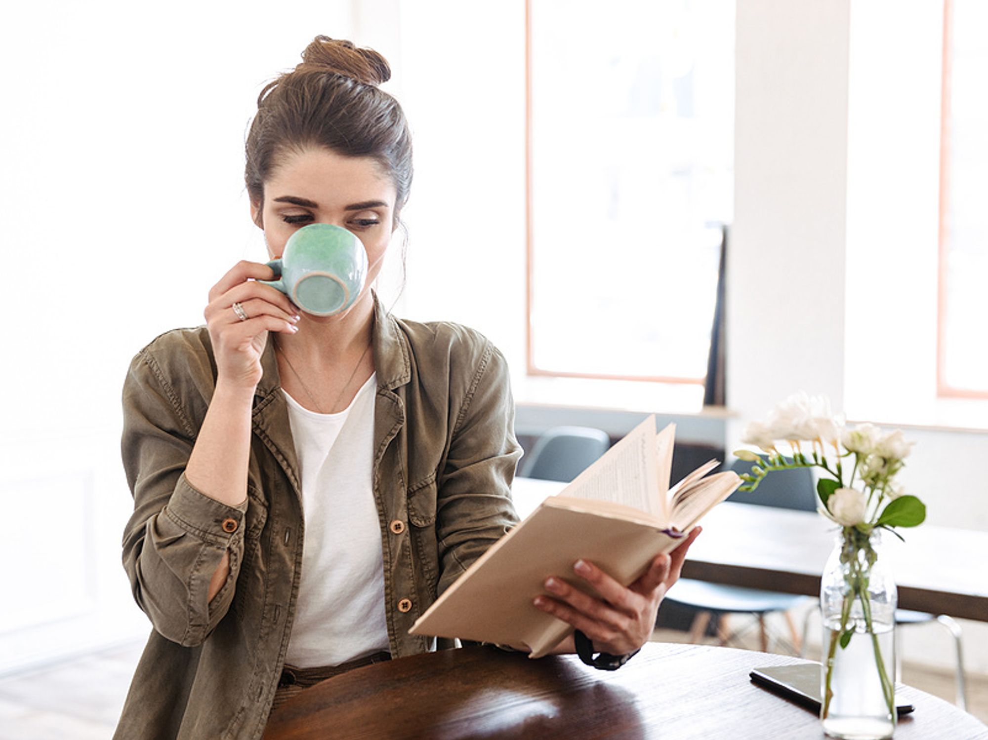 Female executive reads a book