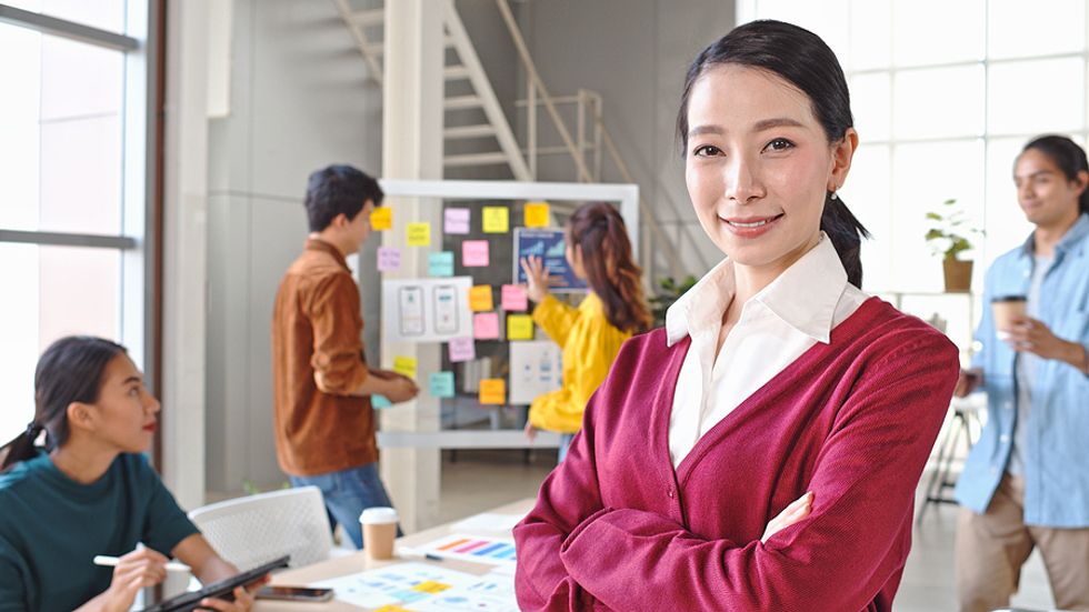 Female executive smiles at the camera
