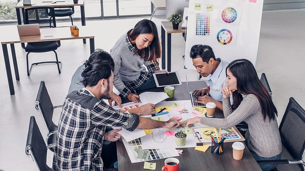 Female leader works with her colleagues during a meeting