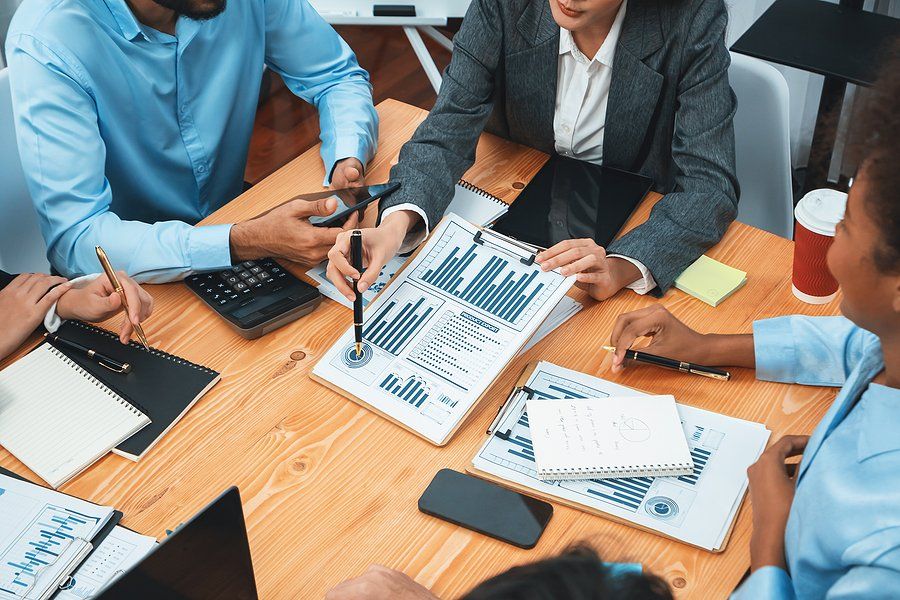 Financial team has a meeting about driving revenue and optimizing profitability