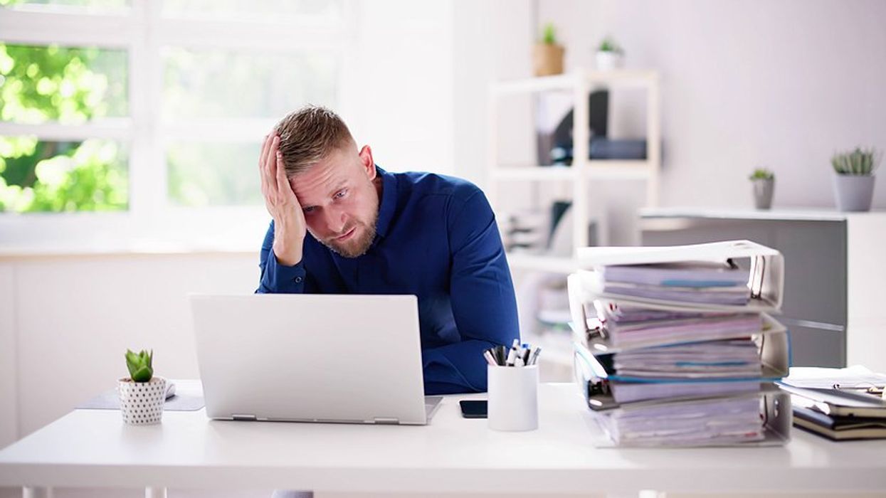 Frustrated man on laptop struggles to get noticed on LinkedIn