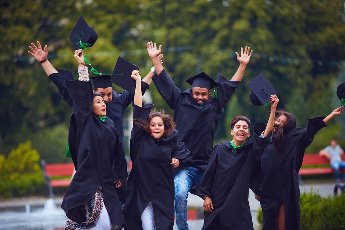 Group of college students celebrate their graduation