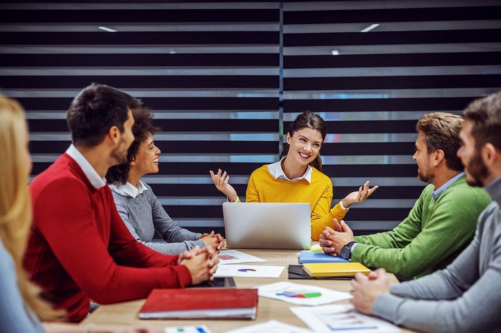 Group of coworkers/professionals in a meeting for a company that promotes gender equality