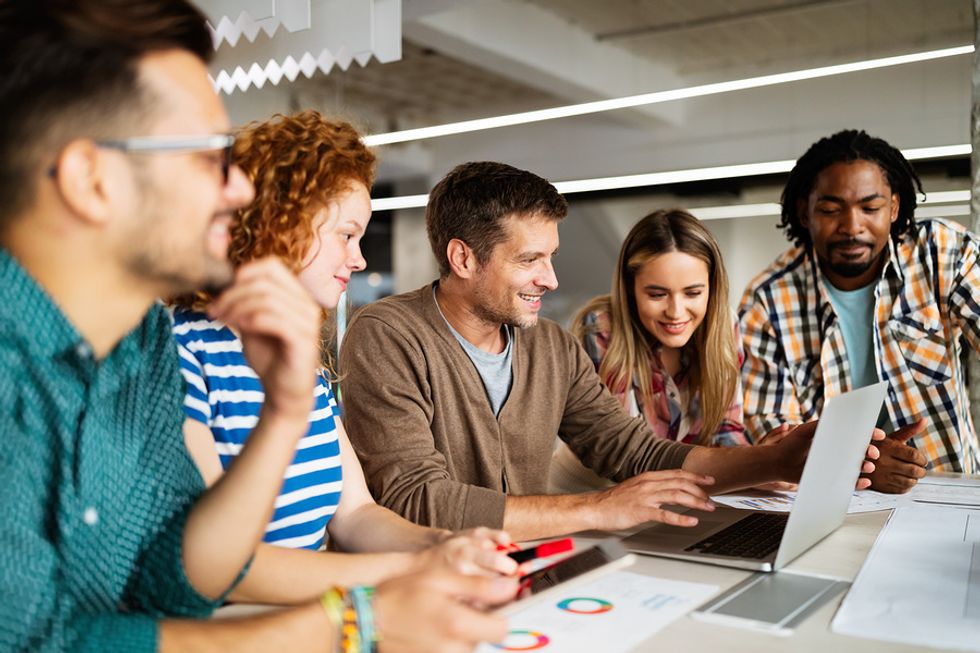 Group of coworkers working together to stand out