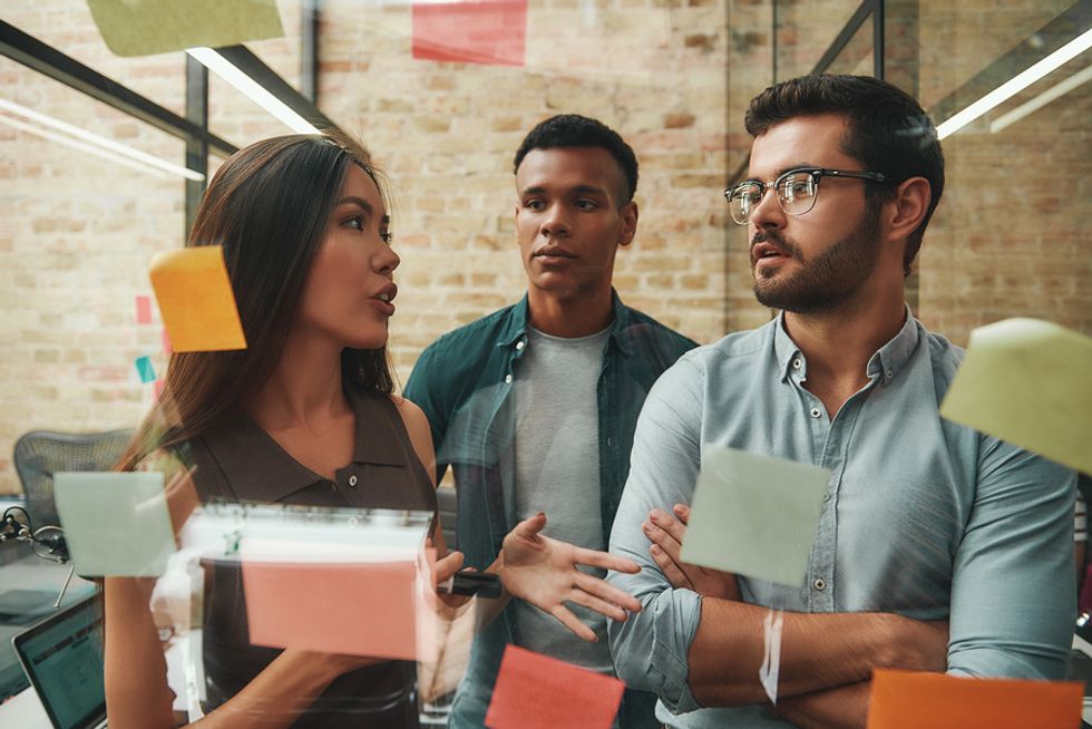 Group of employees/coworkers innovate during a work meeting