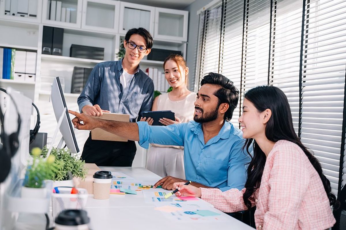 Group of employees measuring success at work