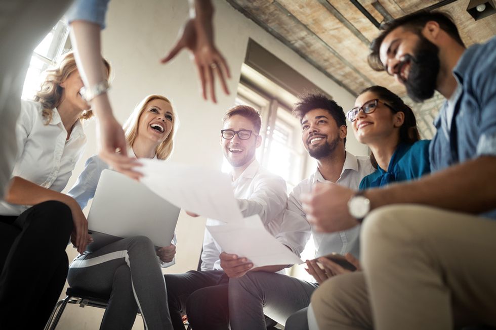 Group of engaged, happy employees at work