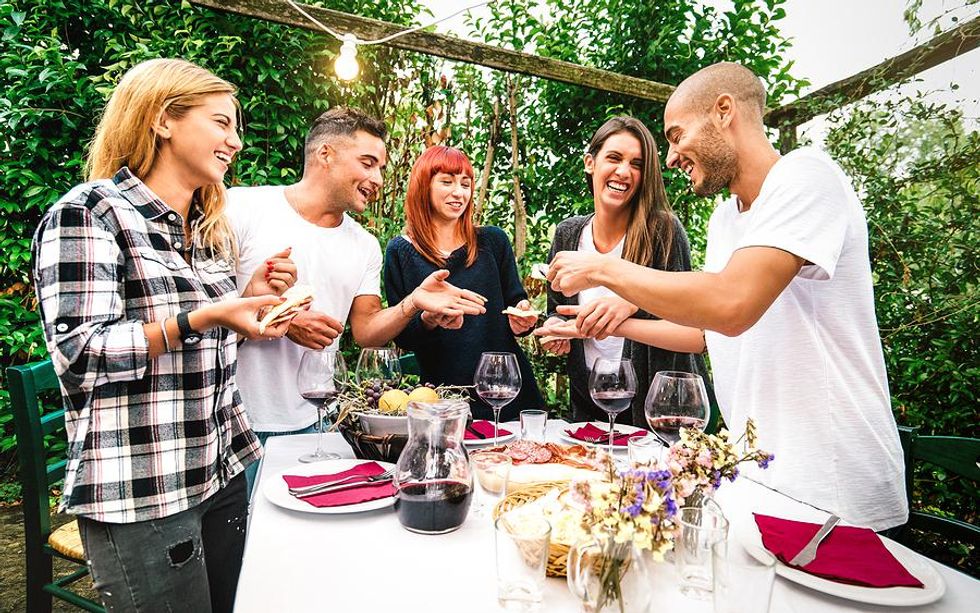 Group of friends eat dinner together