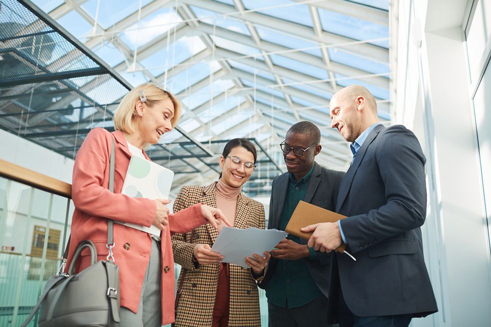 Group of happy professionals networking