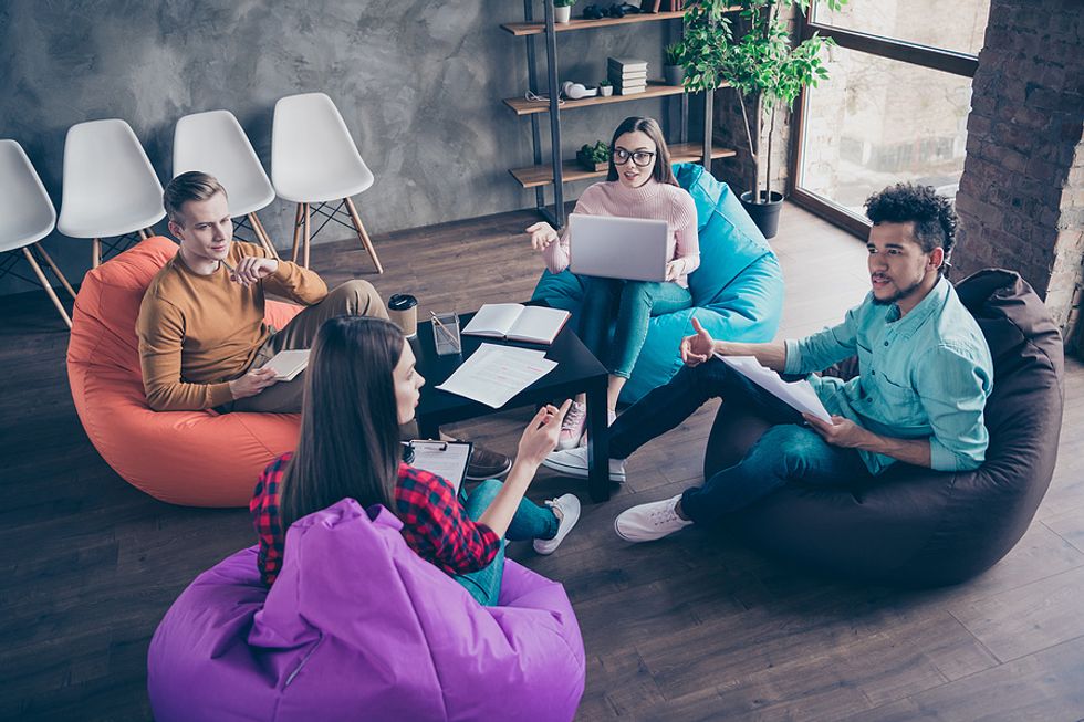 Group of interns / young professionals networking/meeting at work