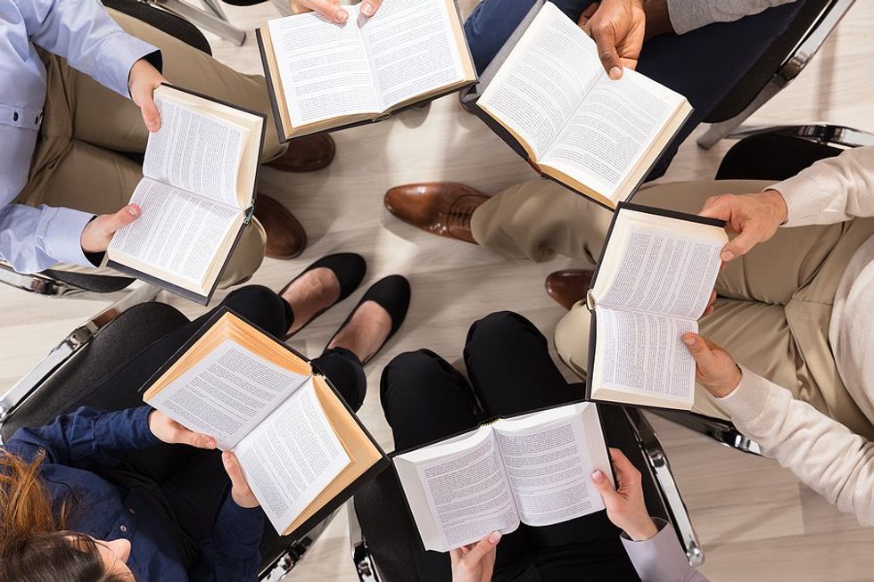 Group of professionals read together