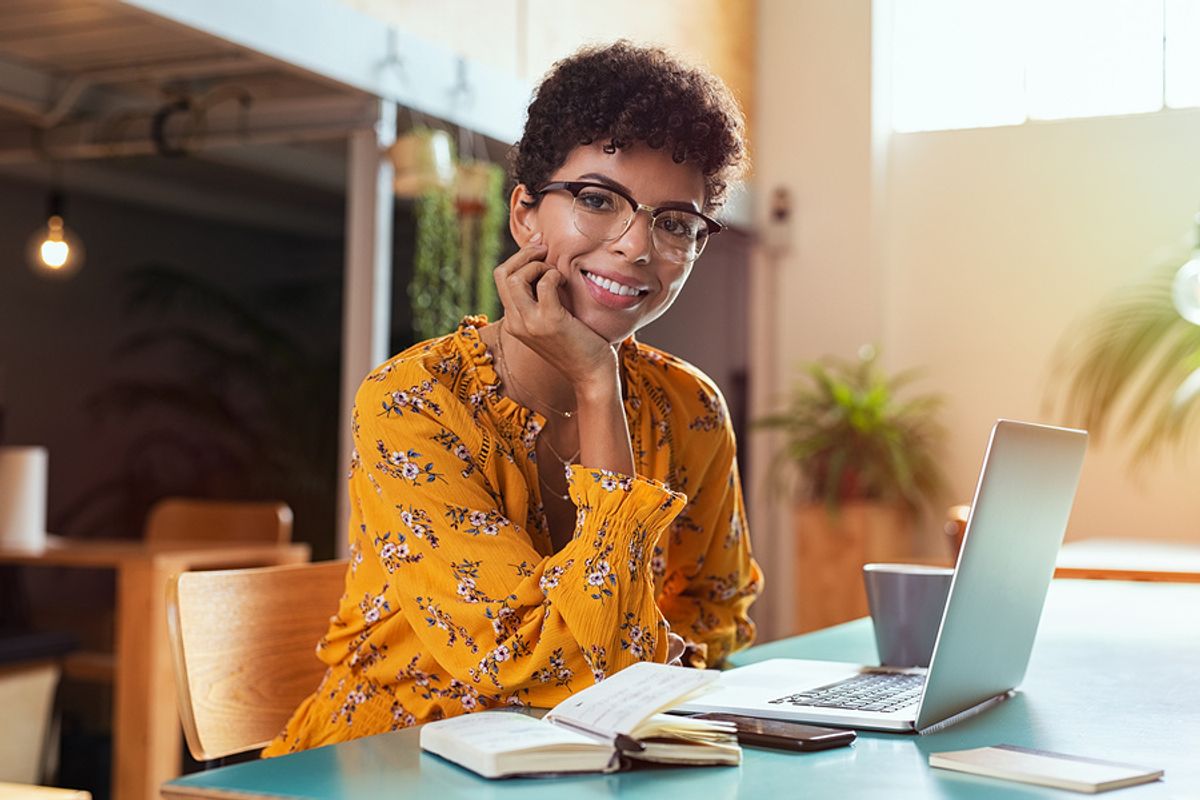 Happy and successful woman thinking about her past failures