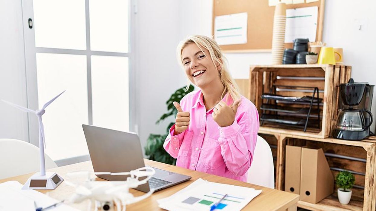 Happy confident woman at work
