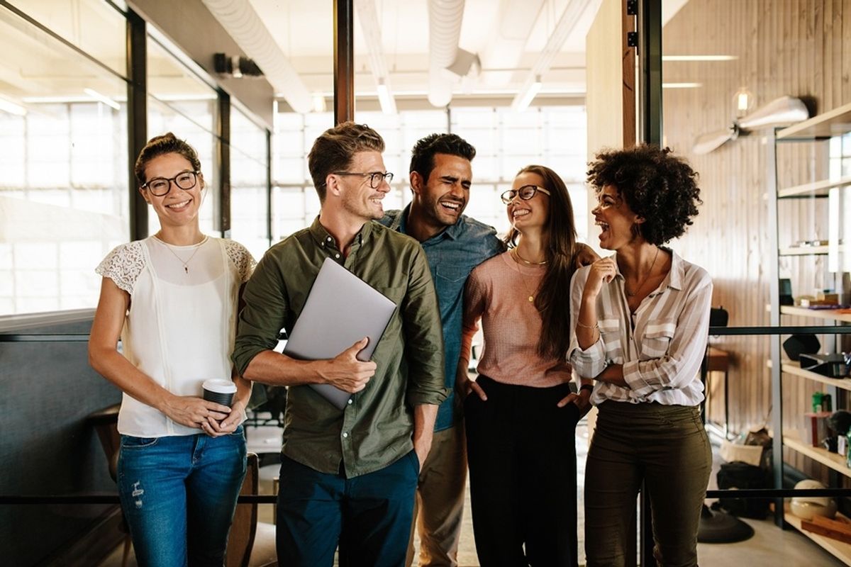 Happy coworkers connecting at work