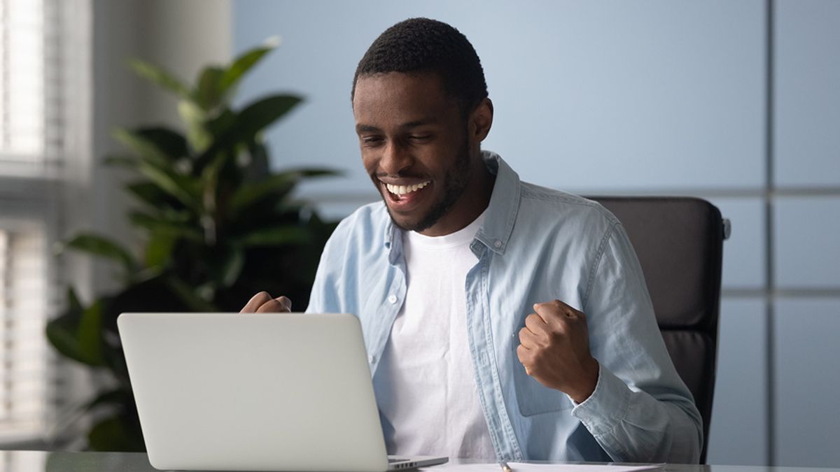Happy employee accomplishes his goals and is ending the work year strong