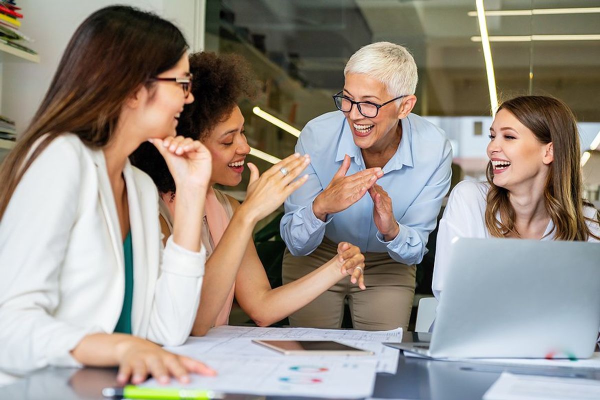 Happy employees talk to the boss they love and respect