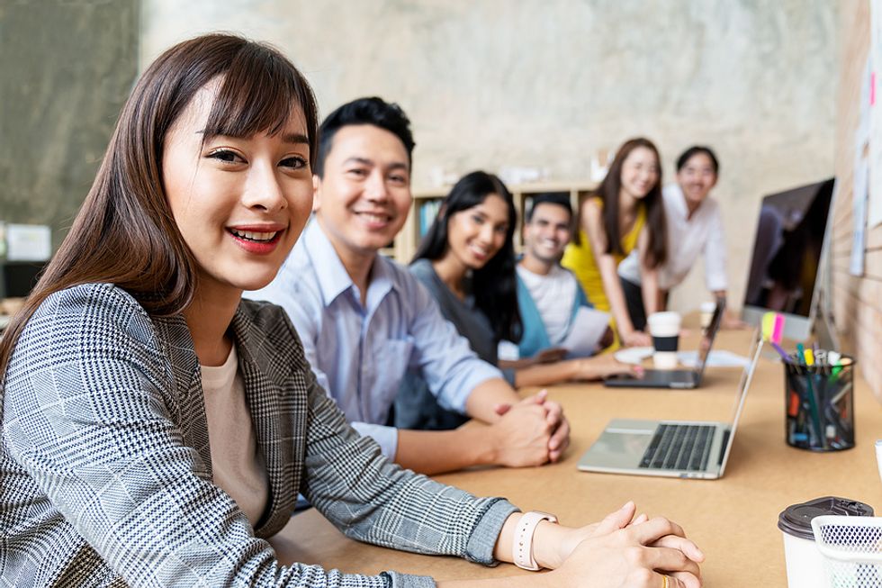 Happy employees working at a company with a good workplace culture