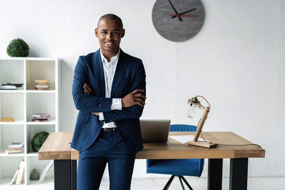 Happy executive focusing on his goals to become a better leader