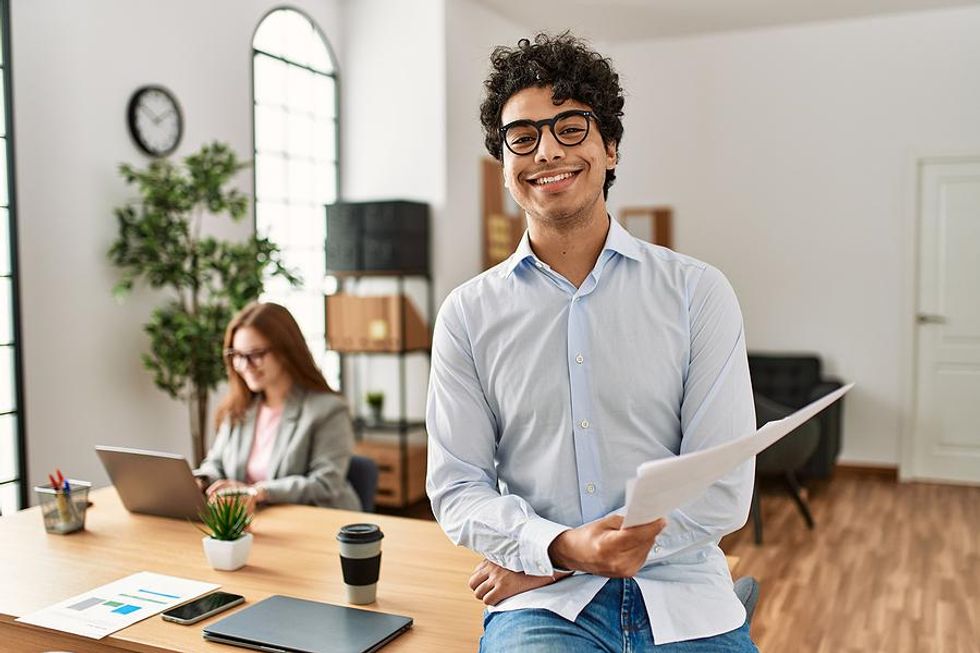 Happy man feels a sense of fulfillment at work