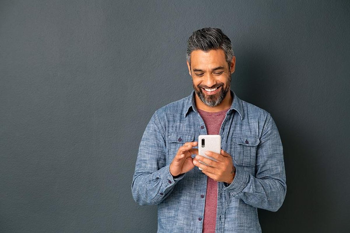 Happy man leaves a voicemail for a job