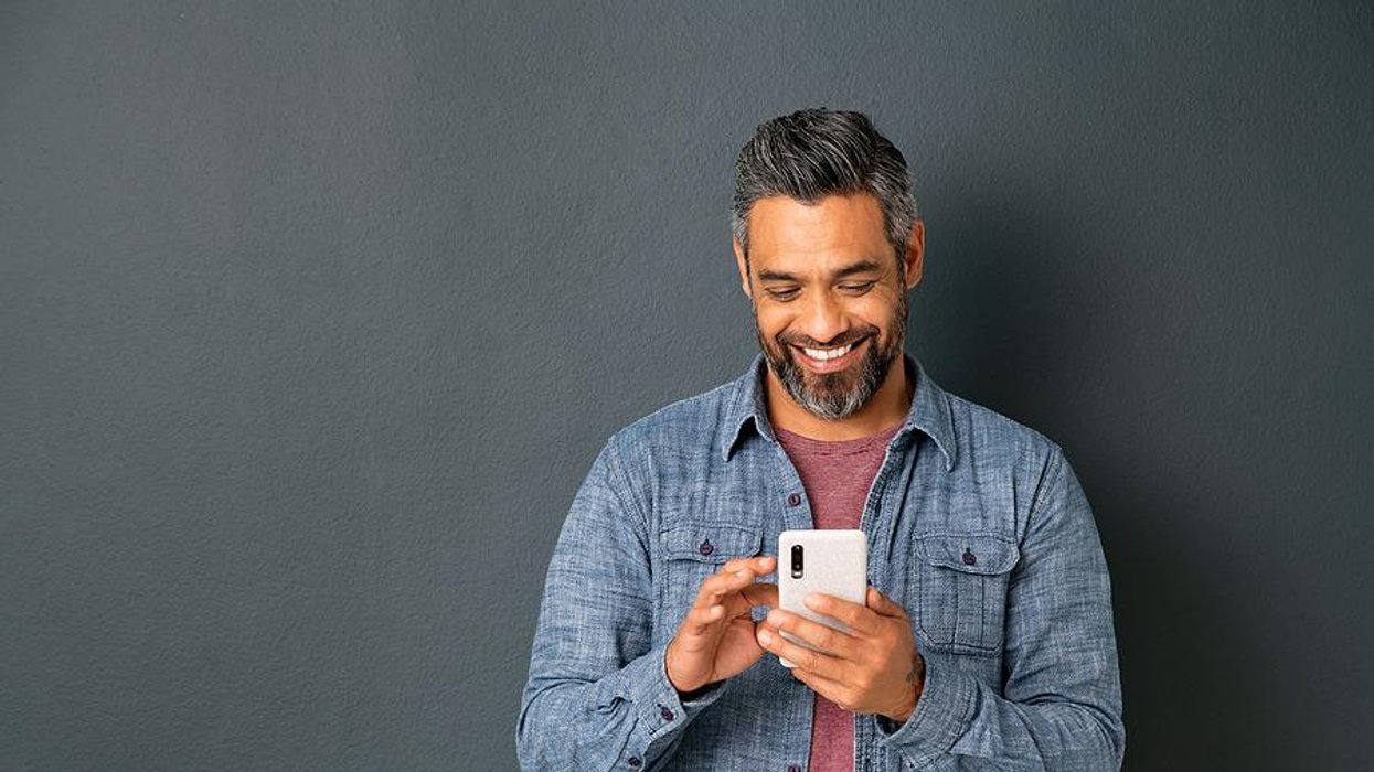 Happy man leaves a voicemail for a job