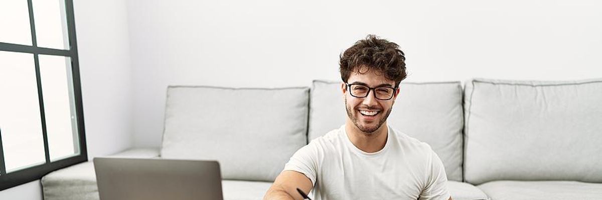 Happy man works a remote job