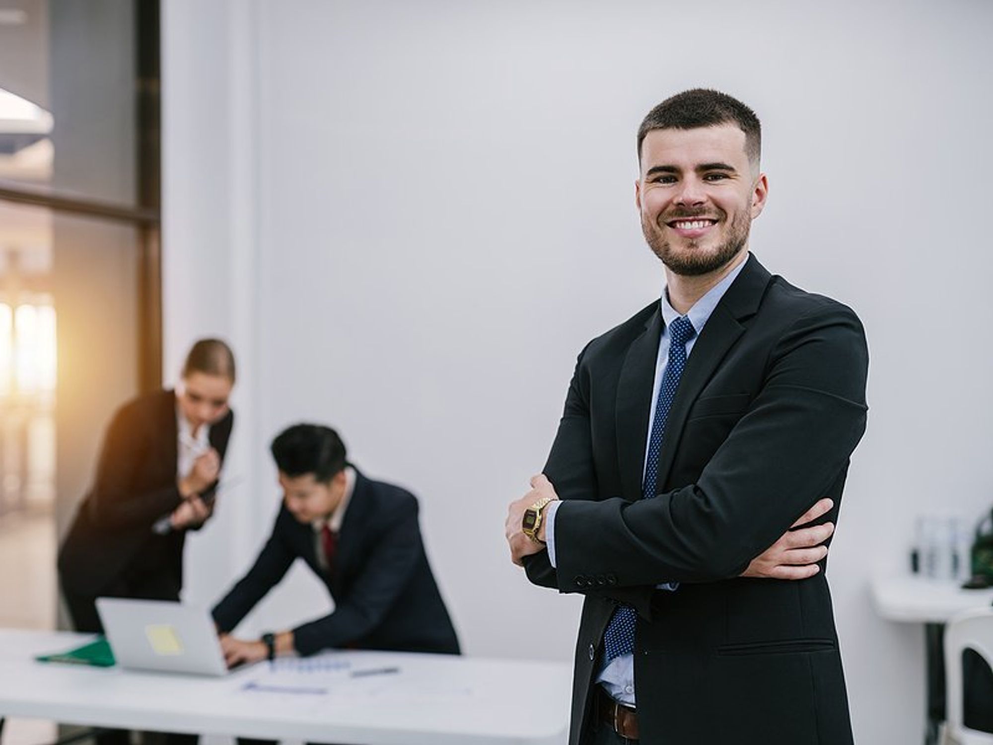 Happy professional man tries to become a better leader at work