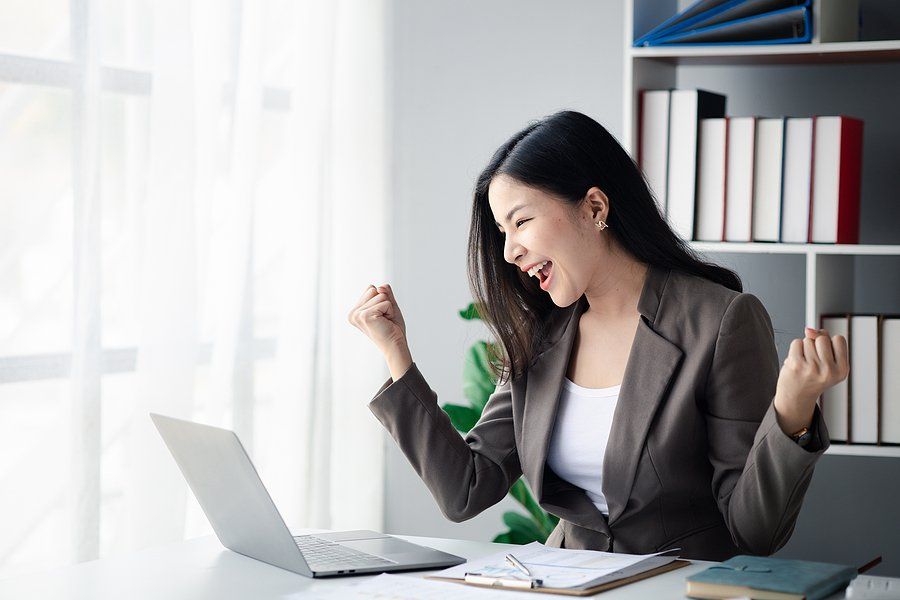 Happy professional woman celebrates changing industries as a manager