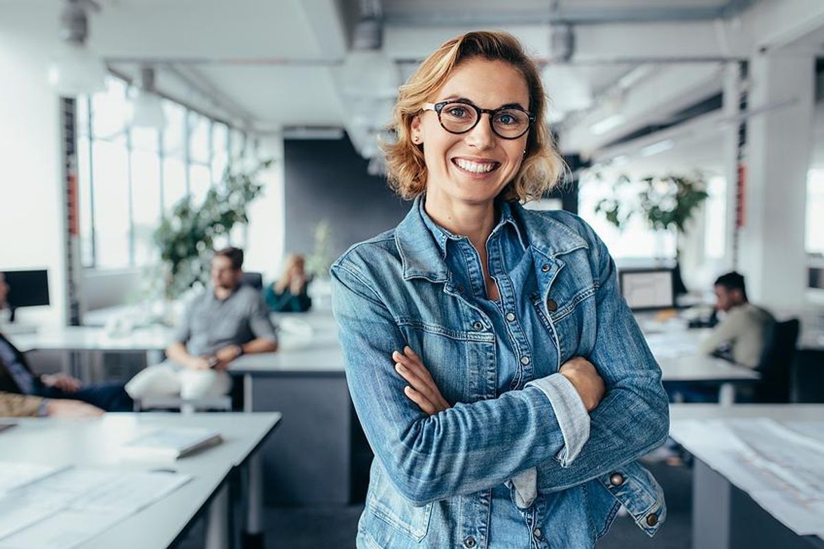 Happy professional woman successfully transitions into a leadership role