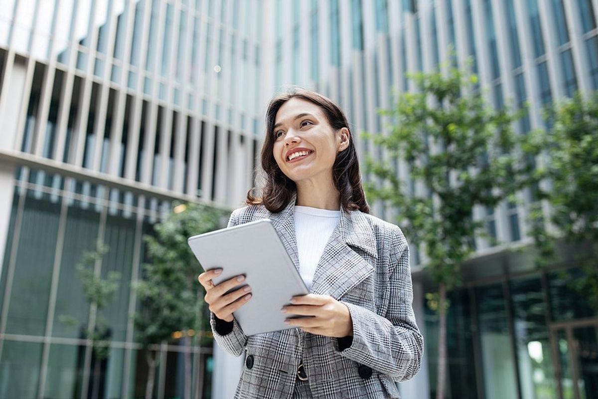 Happy professional woman takes ownership of her career