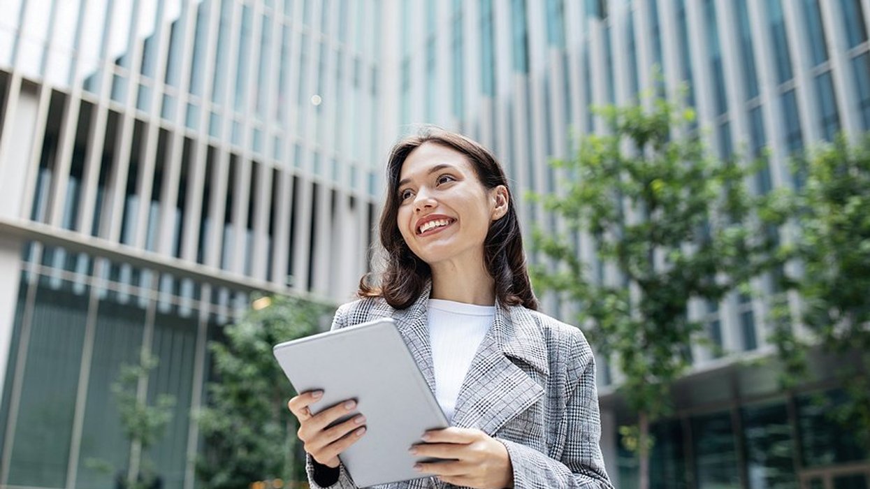 Happy professional woman takes ownership of her career