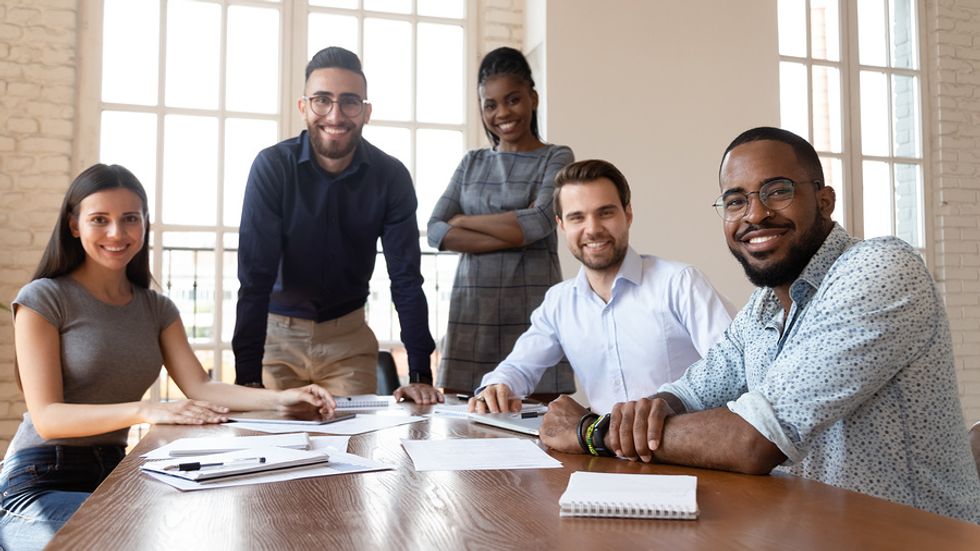 Happy team members meet in a healthy work environment