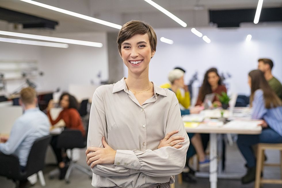 Happy woman at work has a good reputation