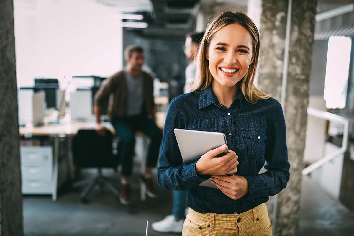 Happy woman gets a promotion after upskilling at work