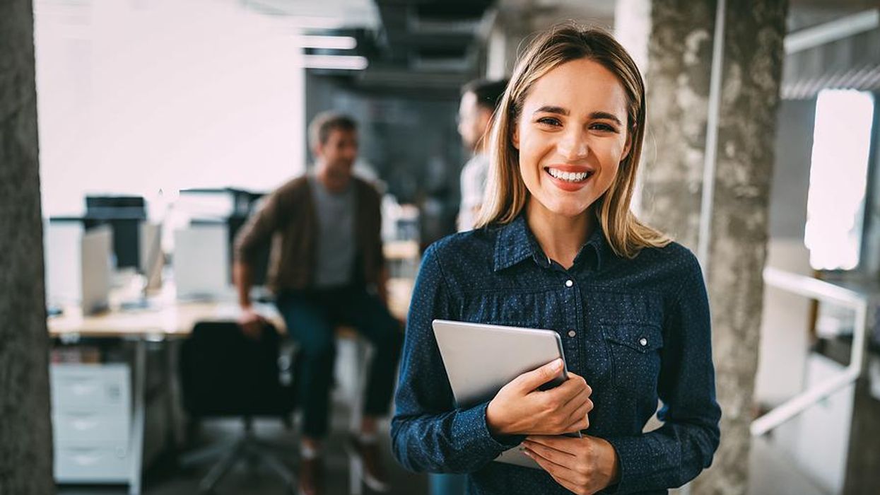 Happy woman gets a promotion after upskilling at work