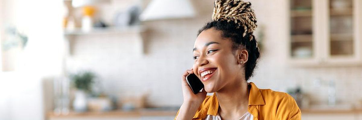 Happy woman on the phone looks for a job