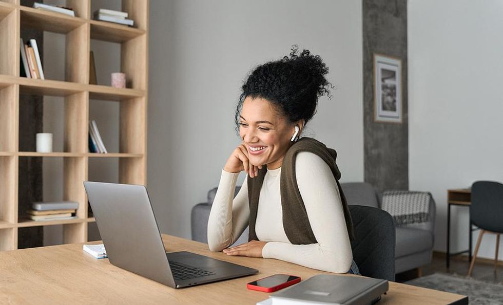 Happy woman works a remote job