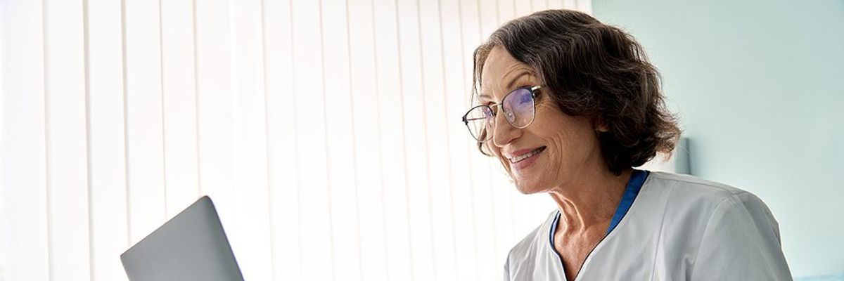 Healthcare professional/doctor talks to a patient about safety